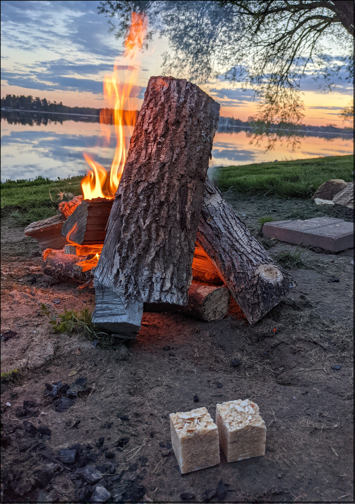 campfire on shore at sunset
