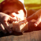 Child reaching for single 100% organic fire starter on table